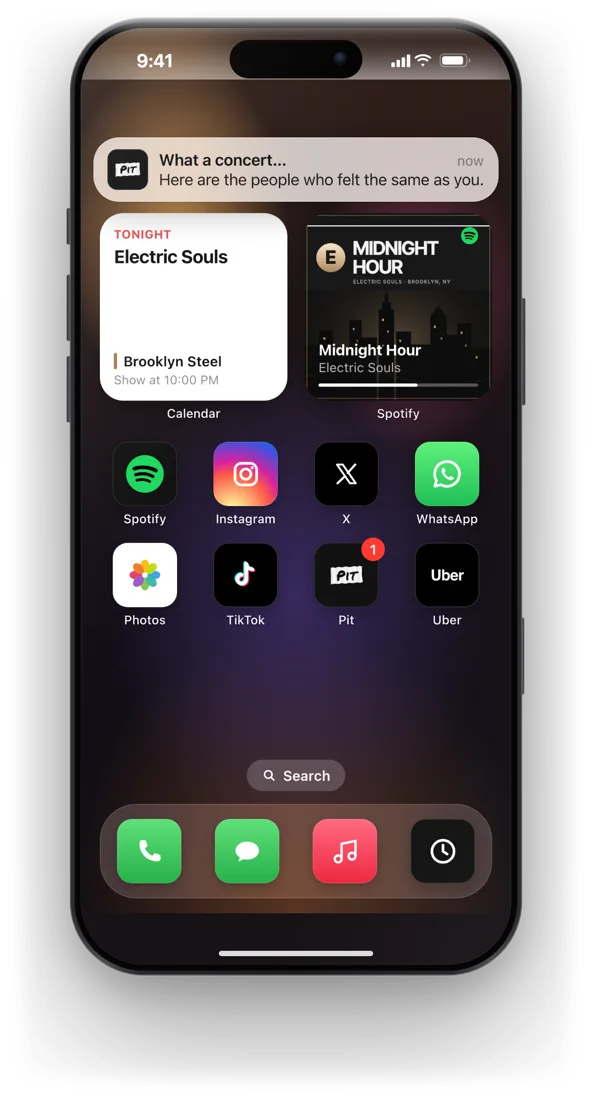 Simulated iPhone home screen with a Pit notification